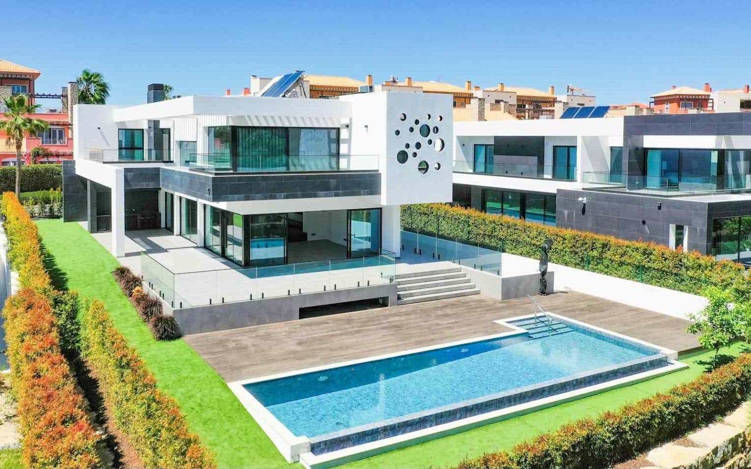 Premium modern residence with a swimming pool and rooftop solar panels